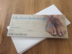 Lila's own printed gift certificate, headed Lila Davis Reflexology, lying on a desk.
